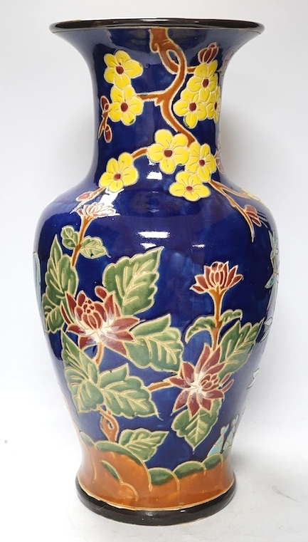 A South East Asian polychrome pottery vase and a Staffordshire pottery greyhound pen holder, vase 53cm high. Condition - vase fair, pen holder marks to glazing